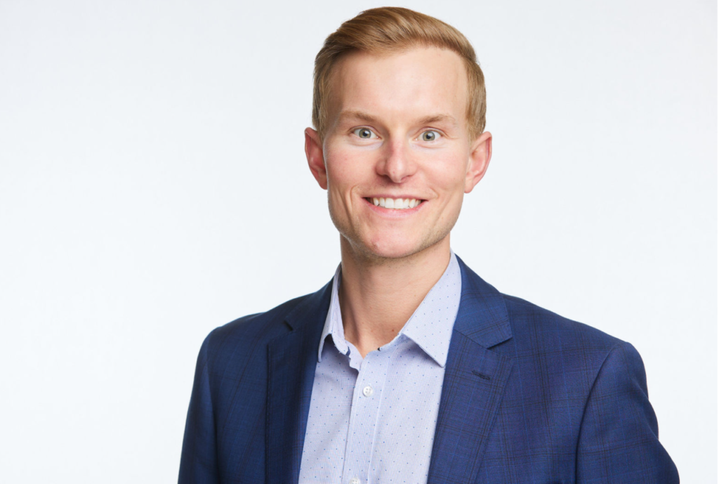 A man in a blue suit and white shirt